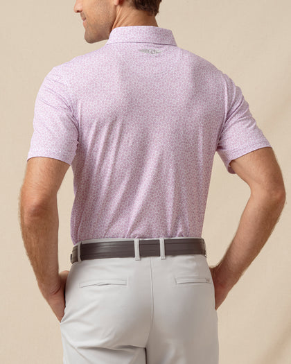 Back view of men’s haze floral print polo with logo detail below the collar