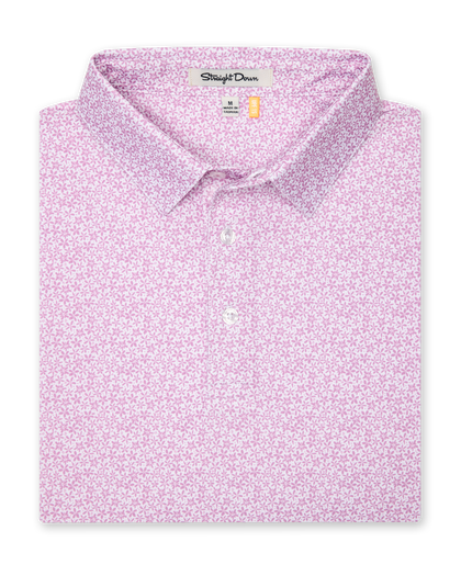 Oleander Polo in haze, folded view showing collar, placket, and pink floral micro-print