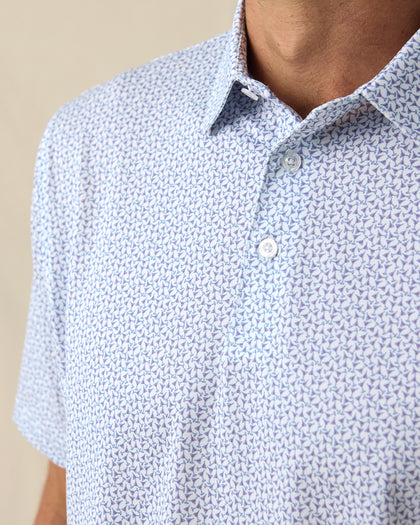 Men's Gin Therapy Polo in Pink Floyd, close-up front chest detail featuring two-button placket and an allover martini glass print in purple and light blue on white