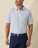 Men's Gin Therapy Polo in Pink Floyd, front view on model featuring an allover martini glass print in purple and light blue on white, paired with navy pants and a navy belt