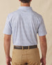 Men's Dog Pound Polo in Moonlight, back model view featuring a white short sleeve polo with an all-over scattered dog face and bone print in navy with the Straight Down logo at the back collar