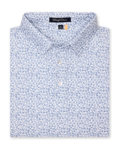 Men's Dog Pound Polo in Moonlight, folded flat lay front view featuring a white short sleeve polo with an all-over scattered dog face and bone print in navy