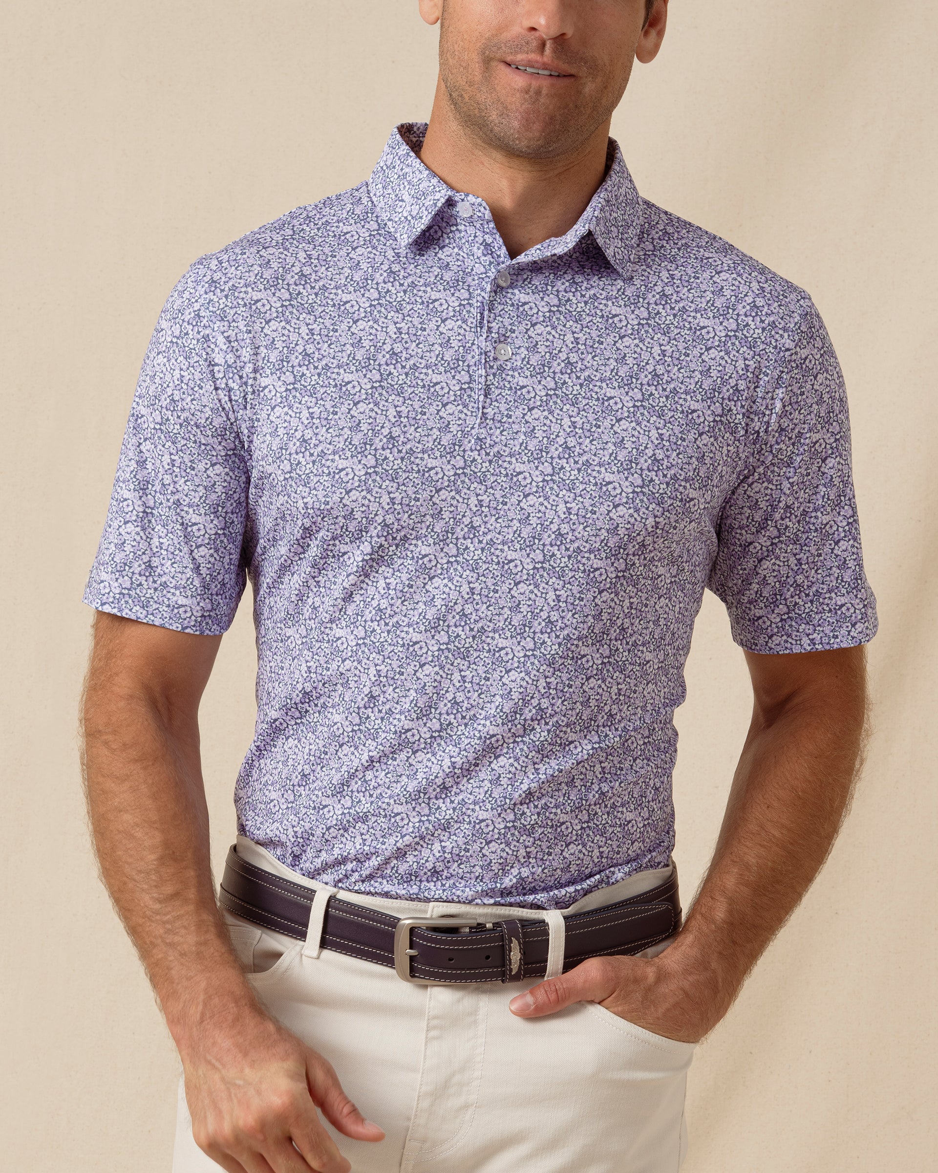 Men’s light purple micro floral print polo shirt styled with light khaki pants and a leather belt