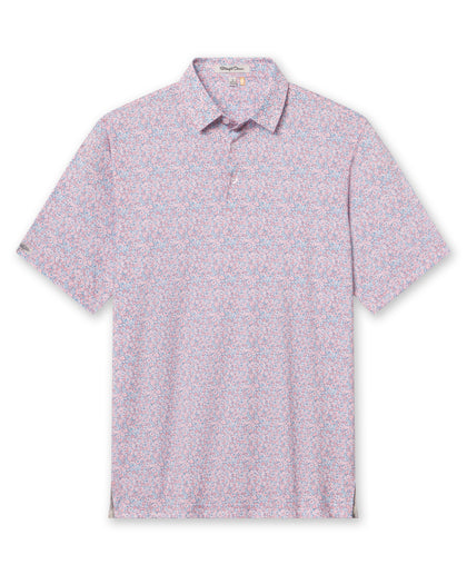 Men's Ocala Polo in Spritz, flat lay front view featuring a blue base with an all-over pink floral print, with Straight Down logo patch visible on sleeve