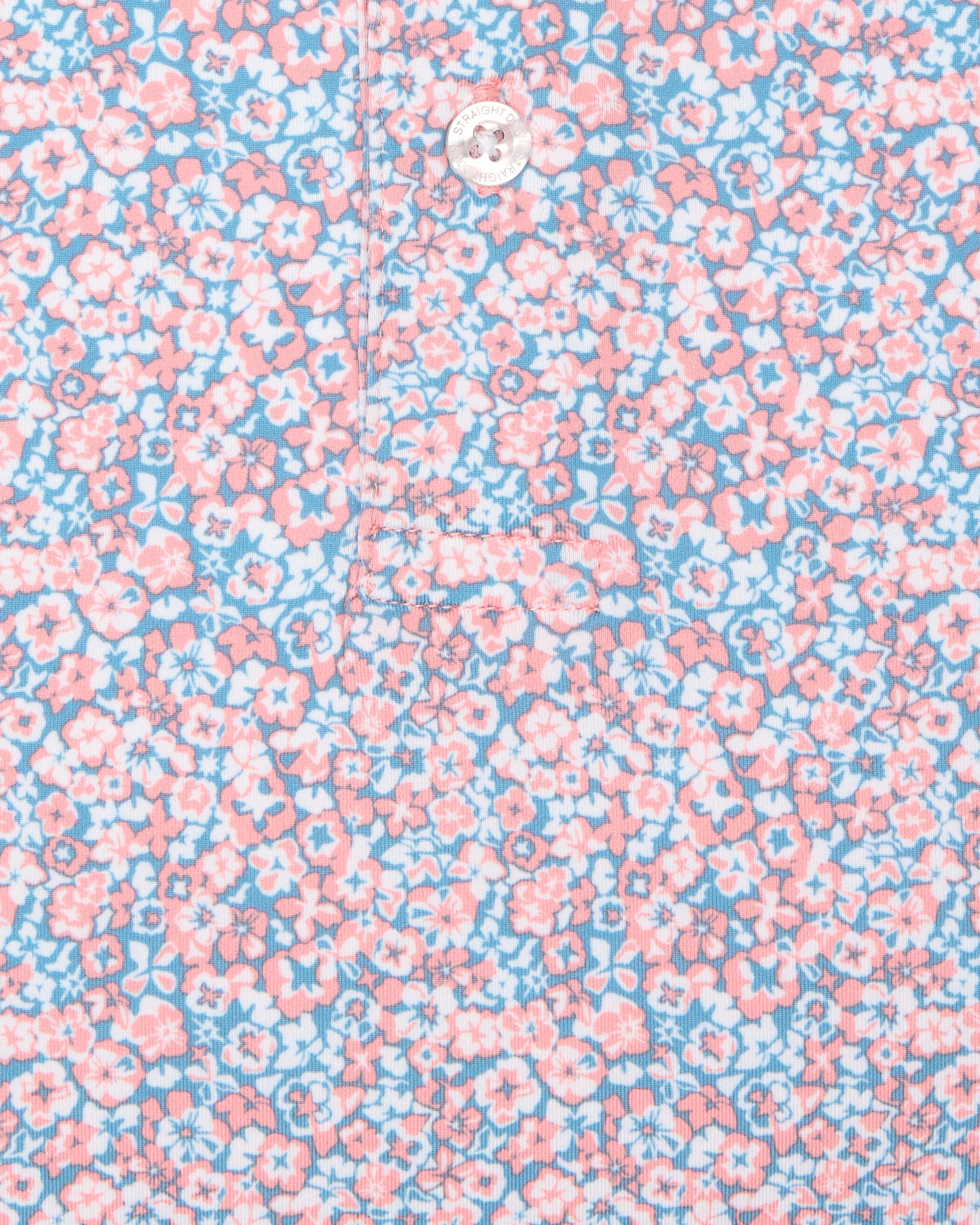 Men's Ocala Polo in Spritz, close-up flat lay fabric detail view highlighting the all-over pink floral print on a blue base