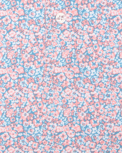 Men's Ocala Polo in Spritz, close-up flat lay fabric detail view highlighting the all-over pink floral print on a blue base