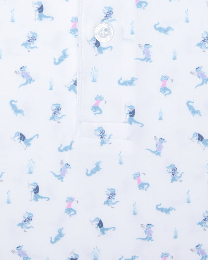 Men's Gators Polo in Violet, close-up flat lay view featuring a white fabric with an all-over scattered golf-playing alligator print in blue and pink with a visible button placket detail