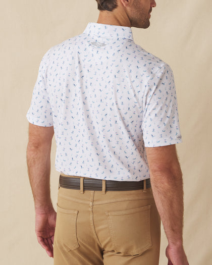 Men's Gators Polo in Violet, back model view featuring a white short sleeve polo with an all-over scattered golf-playing alligator print in blue and pink with the Straight Down logo at the back collar
