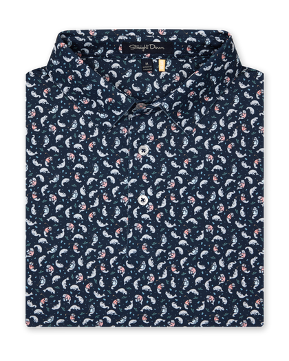 Men's Manatee County Polo in New Indigo, folded flat lay front view featuring a navy short sleeve polo with an all-over scattered golf-playing manatee print in white and pink