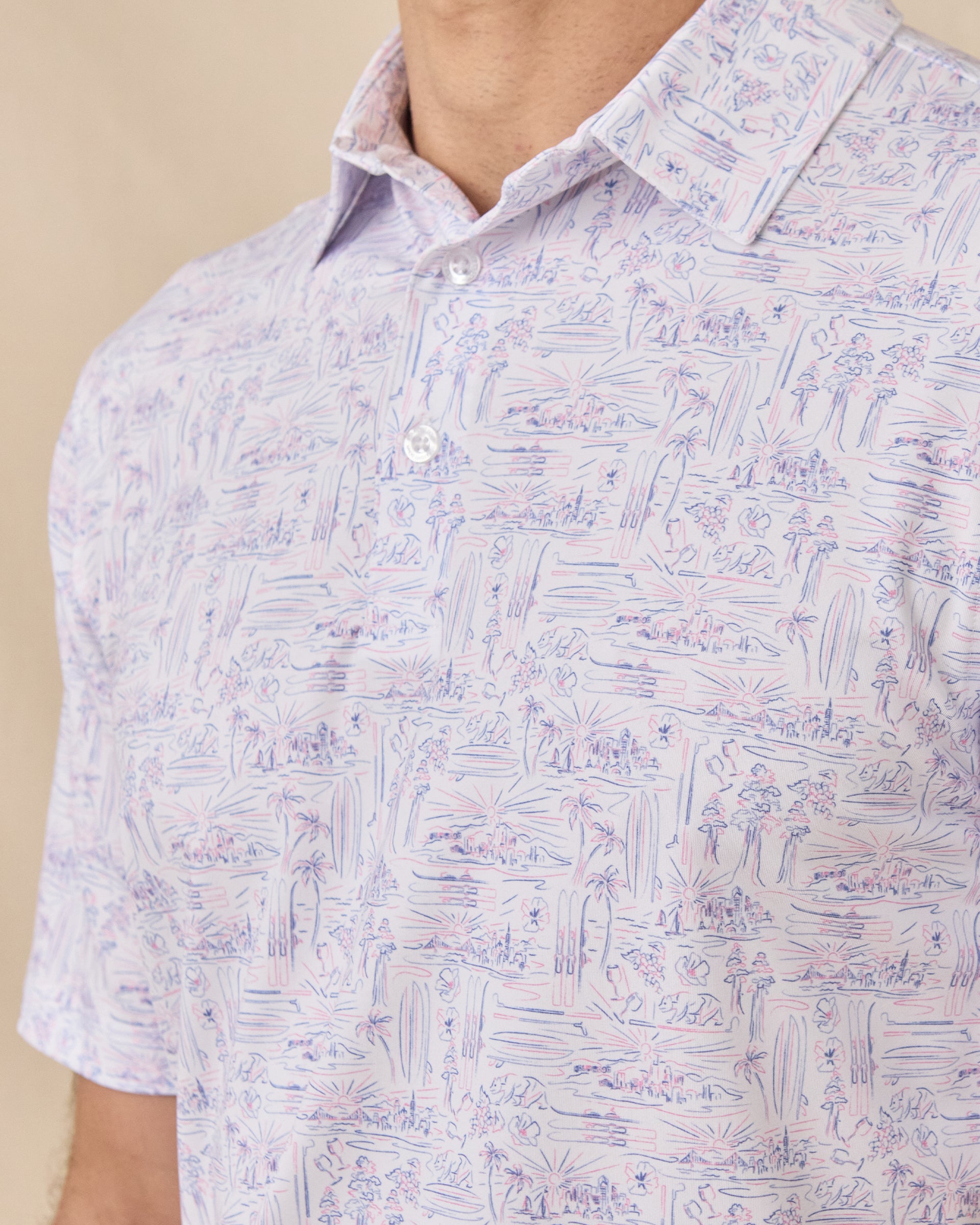 Close-up of the Golden State Polo in Tidal showcasing the California-inspired scenic print, self-collar, and three-button placket