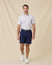 Model styled in the Golden State Polo in Tidal with navy shorts and white sneakers 