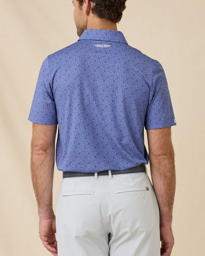 Back view of the Tannins & Tees Polo in Tidal Blue displaying the allover golf and wine-inspired print and embroidered logo below the collar