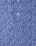 Close-up of the Tannins & Tees Polo in Tidal Blue featuring an allover golf and wine-inspired print