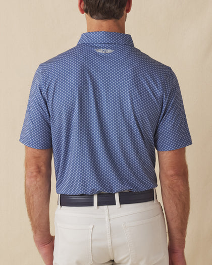 Back view of men’s blue Florian Polo with allover geometric floral print and relaxed fit