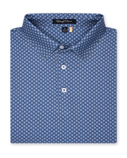 Folded blue Florian Polo showcasing geometric floral print and structured collar