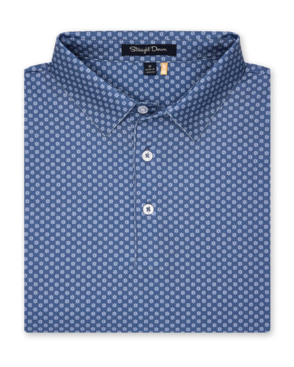 Folded blue Florian Polo showcasing geometric floral print and structured collar