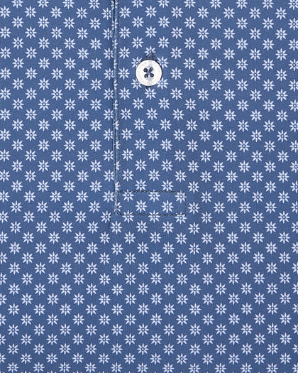 Close-up of blue fabric with small geometric floral print detail