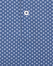 Close-up of blue fabric with small geometric floral print detail
