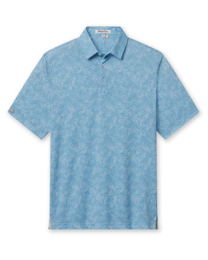Men's Ka'anapali Polo in Coastal, flat lay front view featuring a medium blue short sleeve polo with an allover white tropical floral and palm leaf line-art print