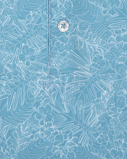 Men's Ka'anapali Polo in Coastal, close-up fabric detail view featuring an allover white tropical floral and palm leaf line-art print on a medium blue performance fabric