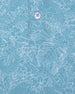 Men's Ka'anapali Polo in Coastal, close-up fabric detail view featuring an allover white tropical floral and palm leaf line-art print on a medium blue performance fabric