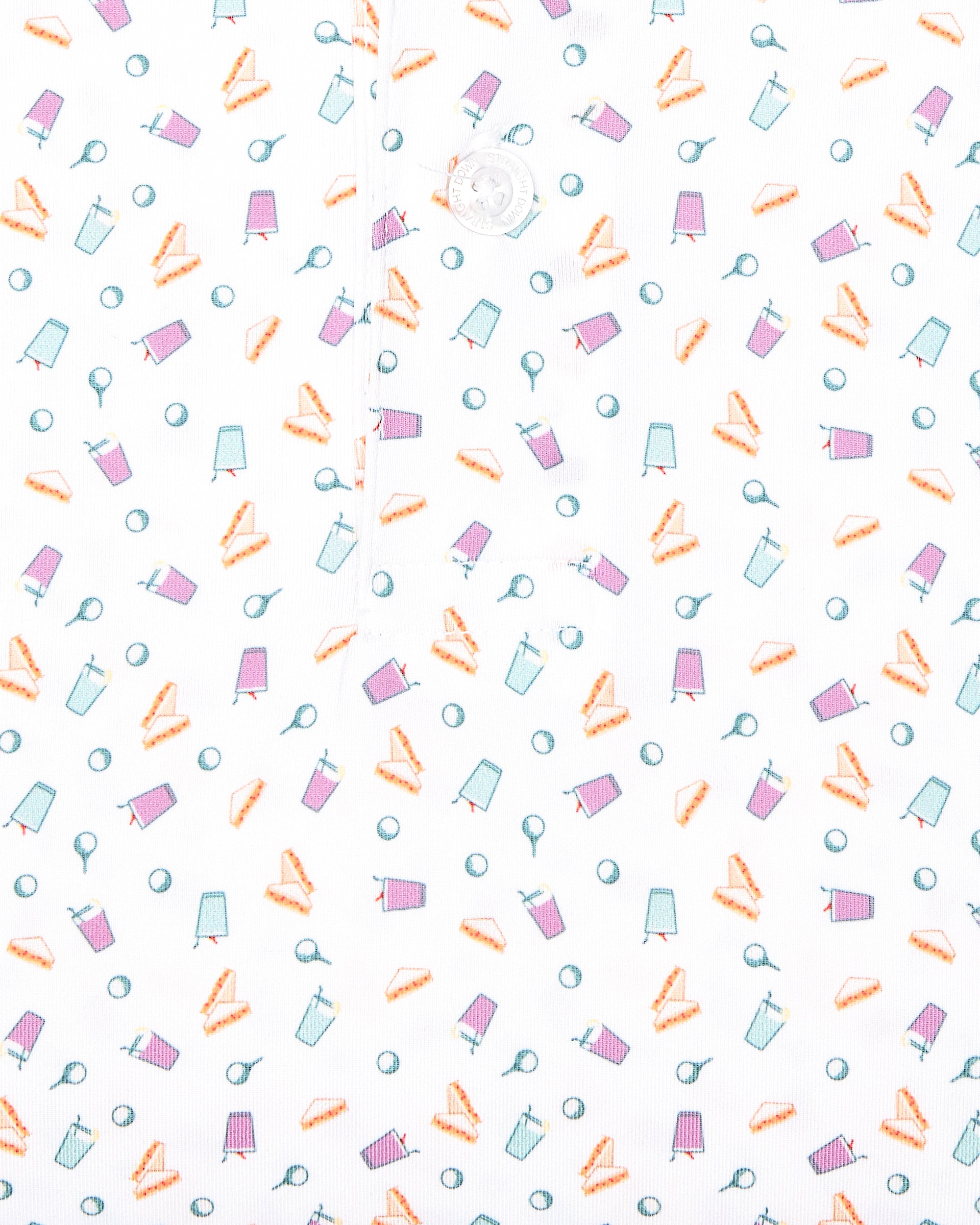 Men's Pimento Cheese Polo in White, close-up flat lay fabric detail view highlighting a scattered golf, sandwich, and drink print in purple, teal, and orange on a white base