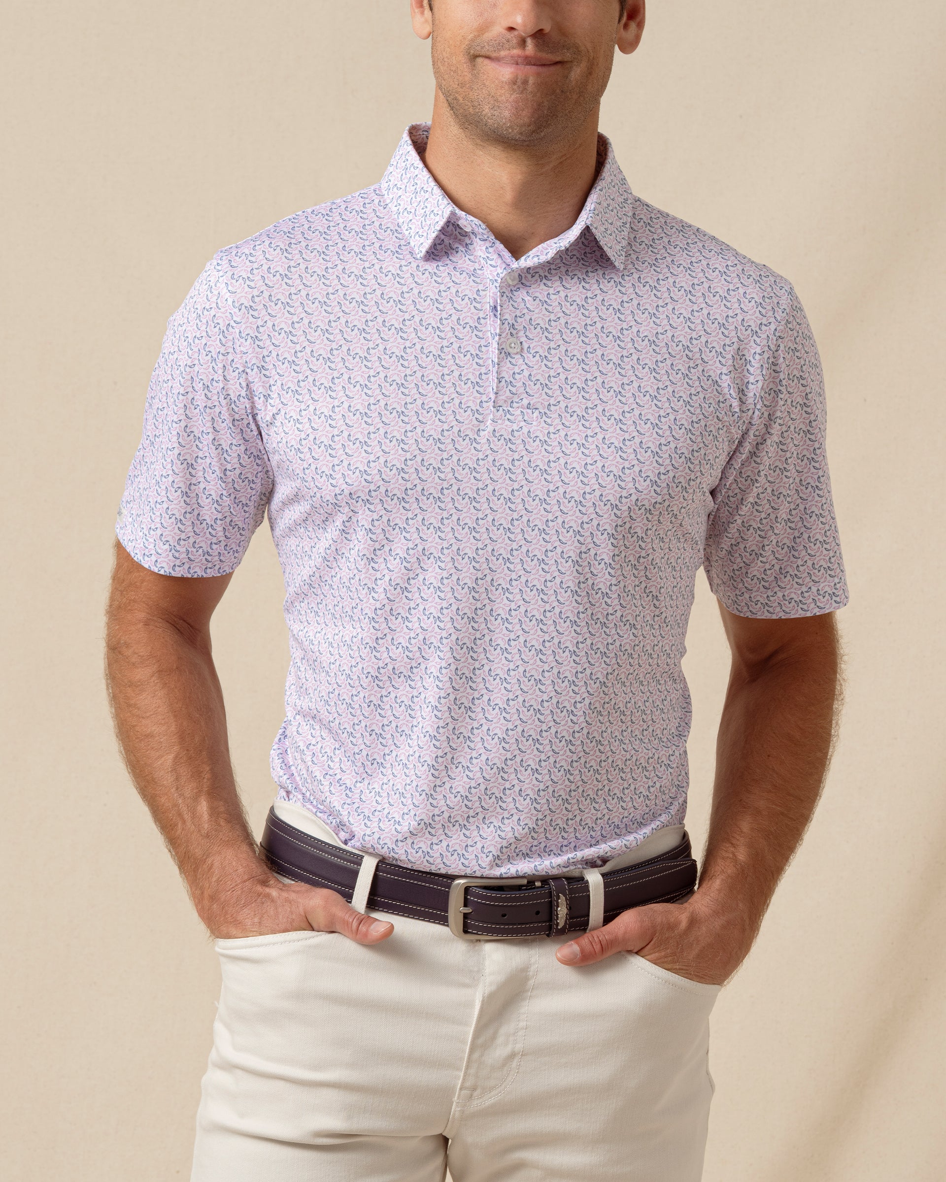 Men’s short sleeve polo featuring an all-over chili pepper print with button placket