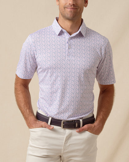 Men’s short sleeve polo featuring an all-over chili pepper print with button placket