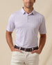Men’s short sleeve polo featuring an all-over chili pepper print with button placket