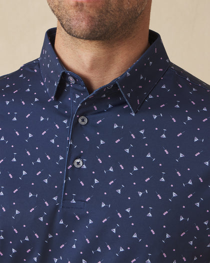 Close-up of navy polo shirt with martini print and button placket detail