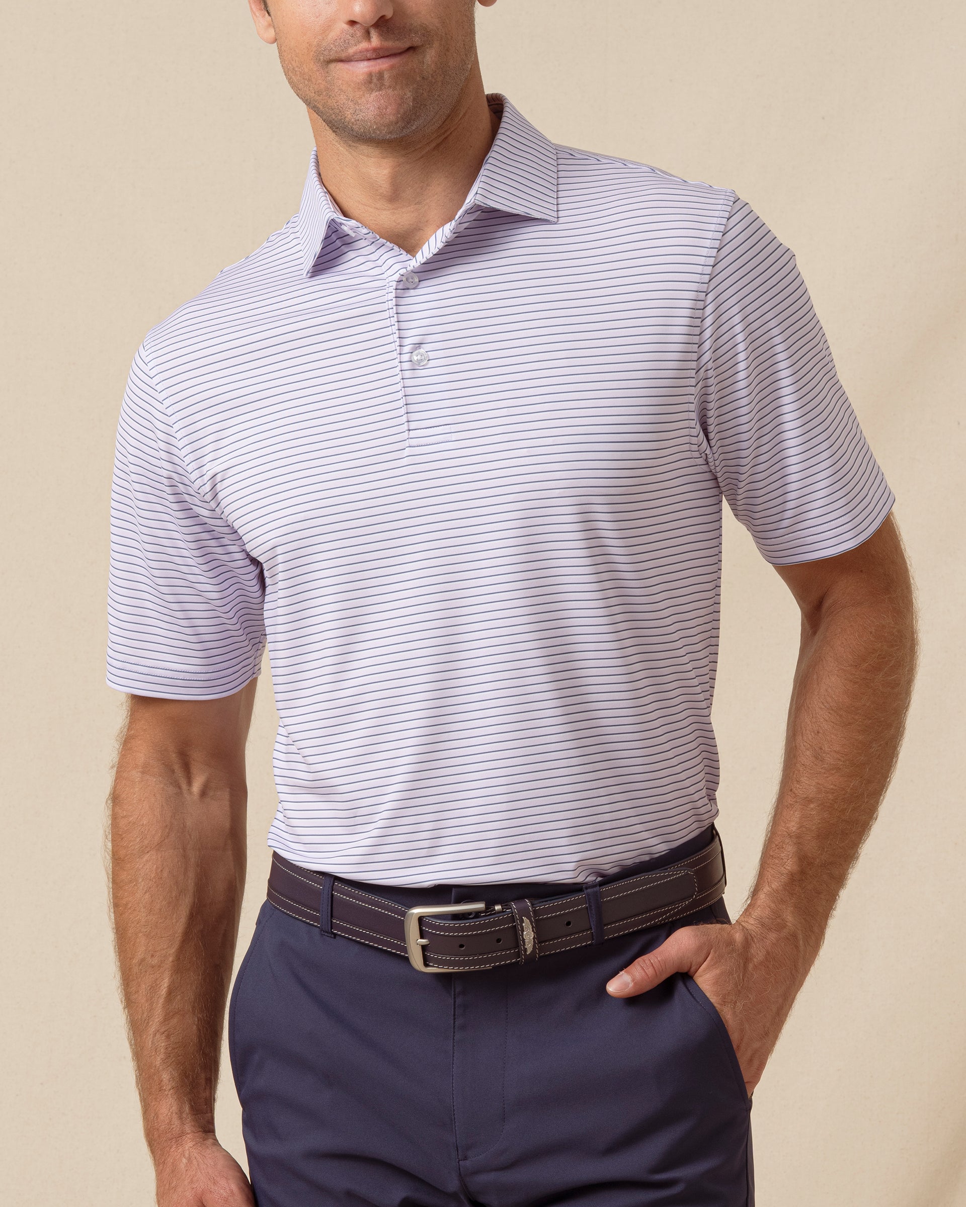 Men’s short sleeve lilac polo featuring a subtle horizontal stripe pattern