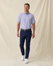 Men's Channel Stripe Polo in Violet, full length model view featuring a lavender short sleeve polo with horizontal navy and white pencil stripes paired with navy pants and white shoes