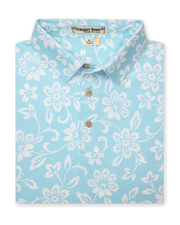 Men's Napali Coast Polo in Gemstone, folded flat lay front view featuring a light aqua blue short sleeve polo with an allover white Hawaiian floral and vine print, with natural wood-tone buttons