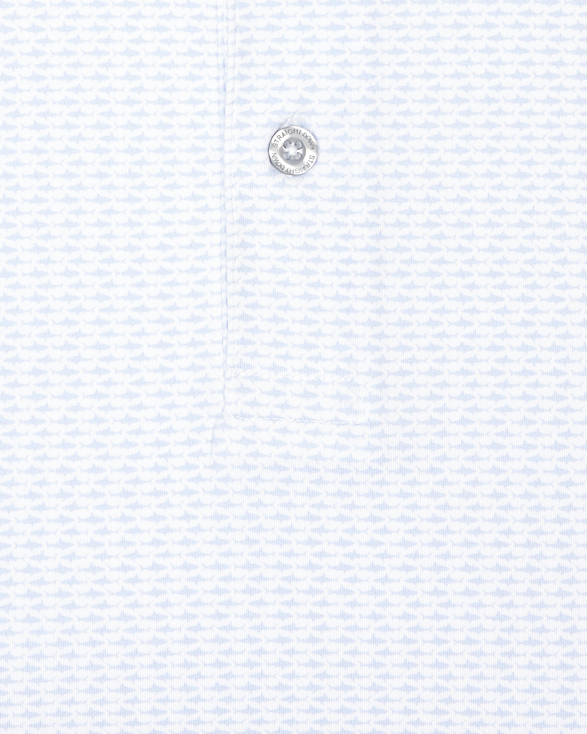Close-up of white golf polo with light blue shark print and button detail