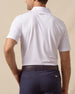 Back view of men’s lilac performance polo with subtle ace-of-spades print tucked into navy shorts