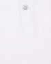 Close-up of polo fabric with subtle ace-of-spades print in lilac and button placket detail