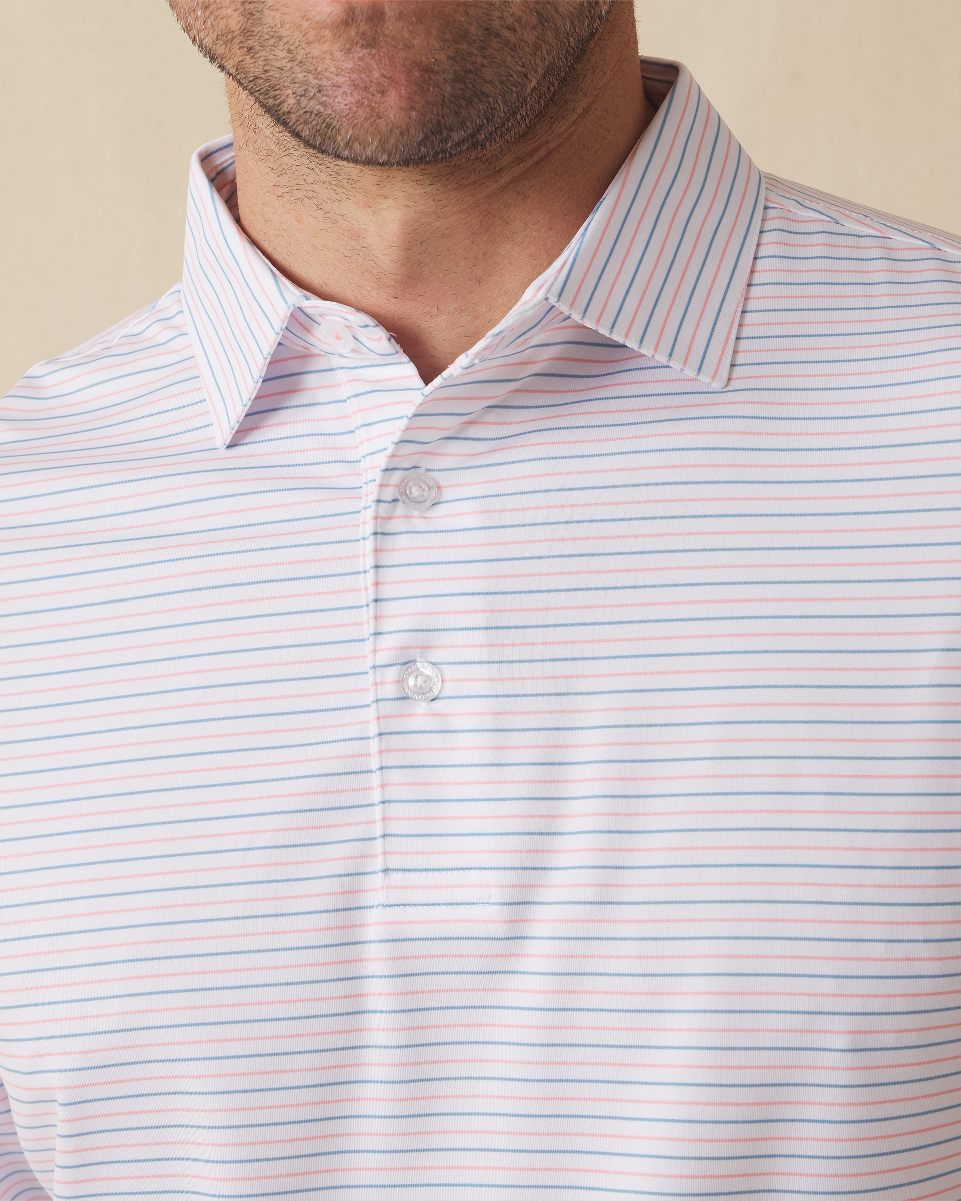 Men's Preserve Stripe Polo in Spritz, collar detail view featuring horizontal pink and blue pinstripes on a white performance fabric