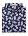 Men's Pineapple Express Polo in New Indigo, folded flat lay front view featuring a navy and white pineapple print with wood buttons