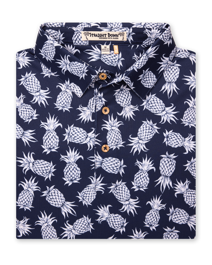 Men's Pineapple Express Polo in New Indigo, folded flat lay front view featuring a navy and white pineapple print with wood buttons