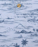 Men's Outrigger Polo in Powder, close-up detail view of the light blue Hawaiian scenic print with wood button