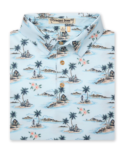 Men's Land Of Aloha Polo in Sea Spray, folded flat lay front view featuring a light blue short sleeve polo with an allover Hawaiian island scene print with palm trees, thatched huts, hula dancers, outrigger canoes, and hibiscus flowers, with a Straight Down Designed with natural wood-tone buttons