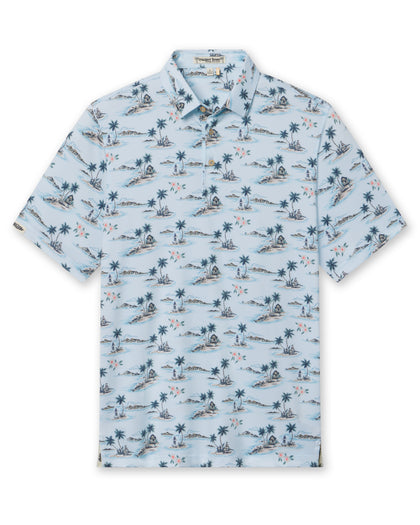 Men's Land Of Aloha Polo in Sea Spray, flat lay front view featuring a light blue short sleeve polo with an allover Hawaiian island scene print with palm trees, thatched huts, hula dancers, outrigger canoes, and hibiscus flowers