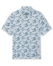 Men's Land Of Aloha Polo in Sea Spray, flat lay front view featuring a light blue short sleeve polo with an allover Hawaiian island scene print with palm trees, thatched huts, hula dancers, outrigger canoes, and hibiscus flowers
