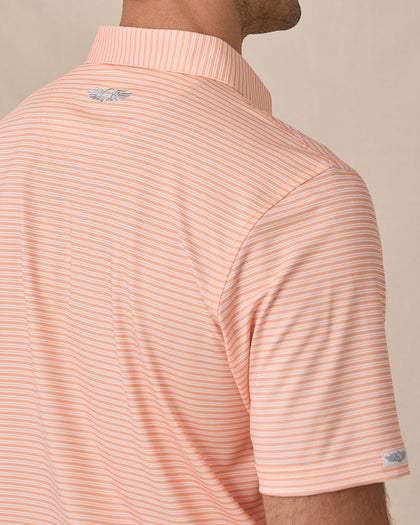 Close-up of the back of the Campus Stripe Polo in Cantaloupe showing the striped fabric and embroidered logo below the collar.