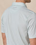Close-up of the Campus Stripe Polo in Herb showing the striped fabric and embroidered logo below the collar.