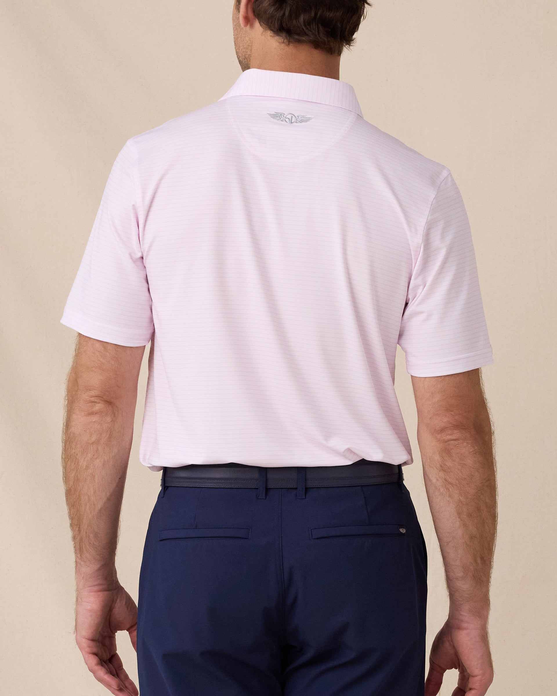 Back view of the Campus Stripe Polo in lilac featuring an allover horizontal stripe design and signature embroidered logo below the collar