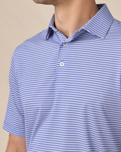 Close-up of the Campus Stripe Polo in Tidal Blue highlighting the self-collar, three-button placket, and blue and white stripe pattern
