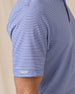Close-up of the Campus Stripe Polo in Tidal Blue highlighting the striped performance fabric, sleeve construction, and signature sleeve logo tab