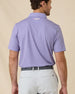 Back view of the Ironwood Polo in tidal blue featuring the all-over geometric print and embroidered Straight Down logo below the collar