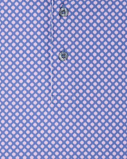 Close-up of the Ironwood Polo in tidal blue highlighting the pink geometric print and branded buttons